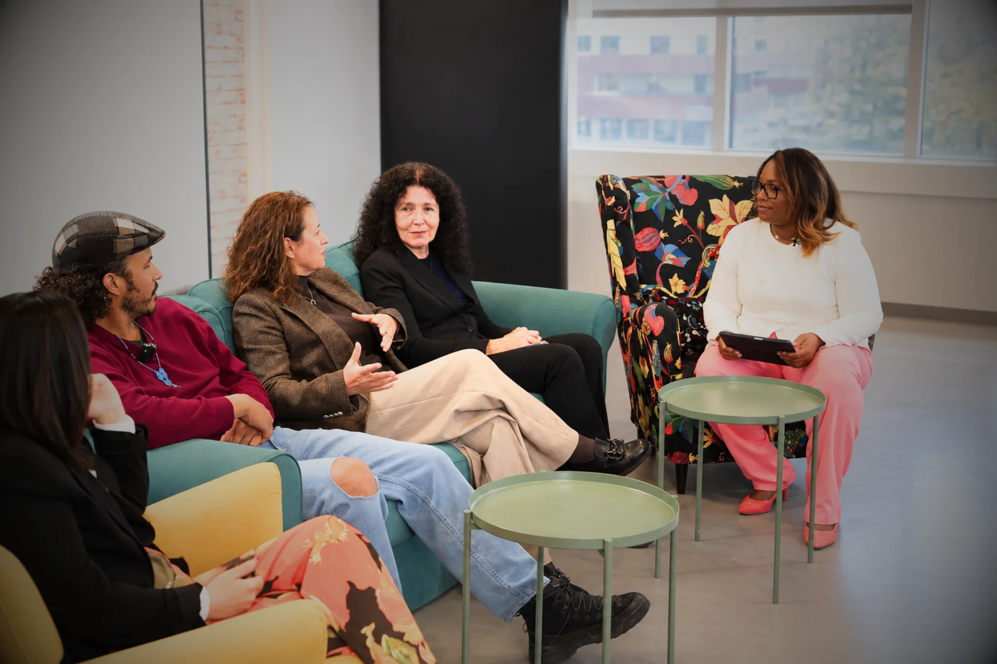 Nathalia hosting a group conversation with guests